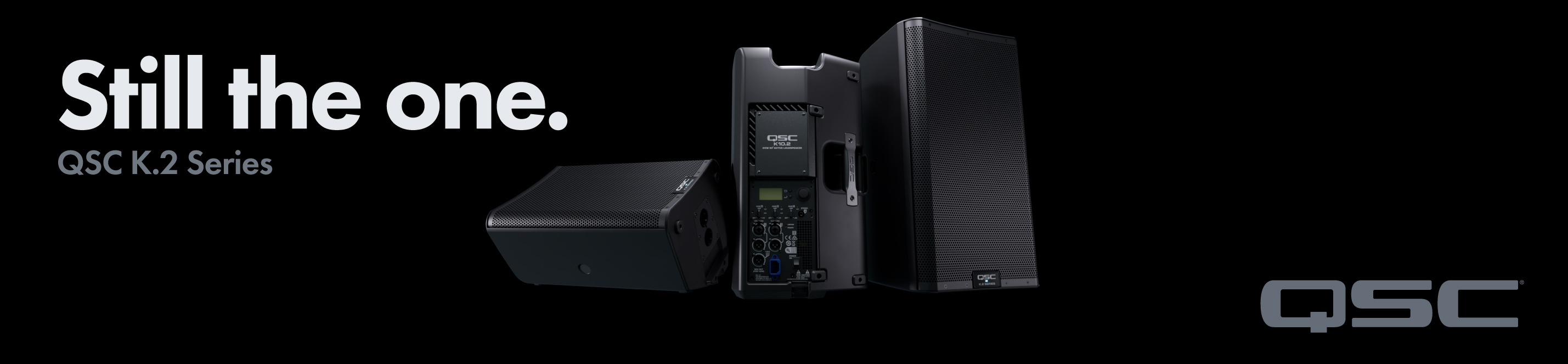 Promotional banner for QSC K.2 Series speakers showing multiple black units with the slogan ‘Still the one’.